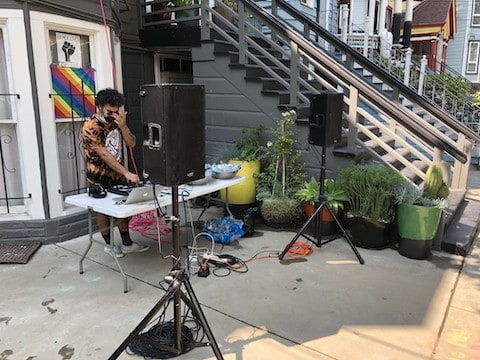 DJ playing music in front of house in San Francisco