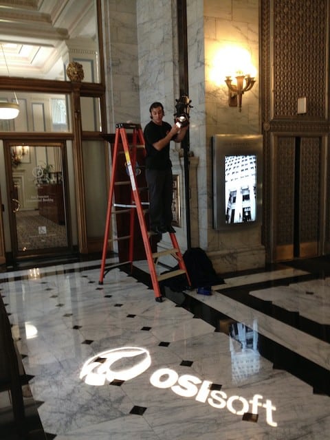 gobo light being setup in office lobby