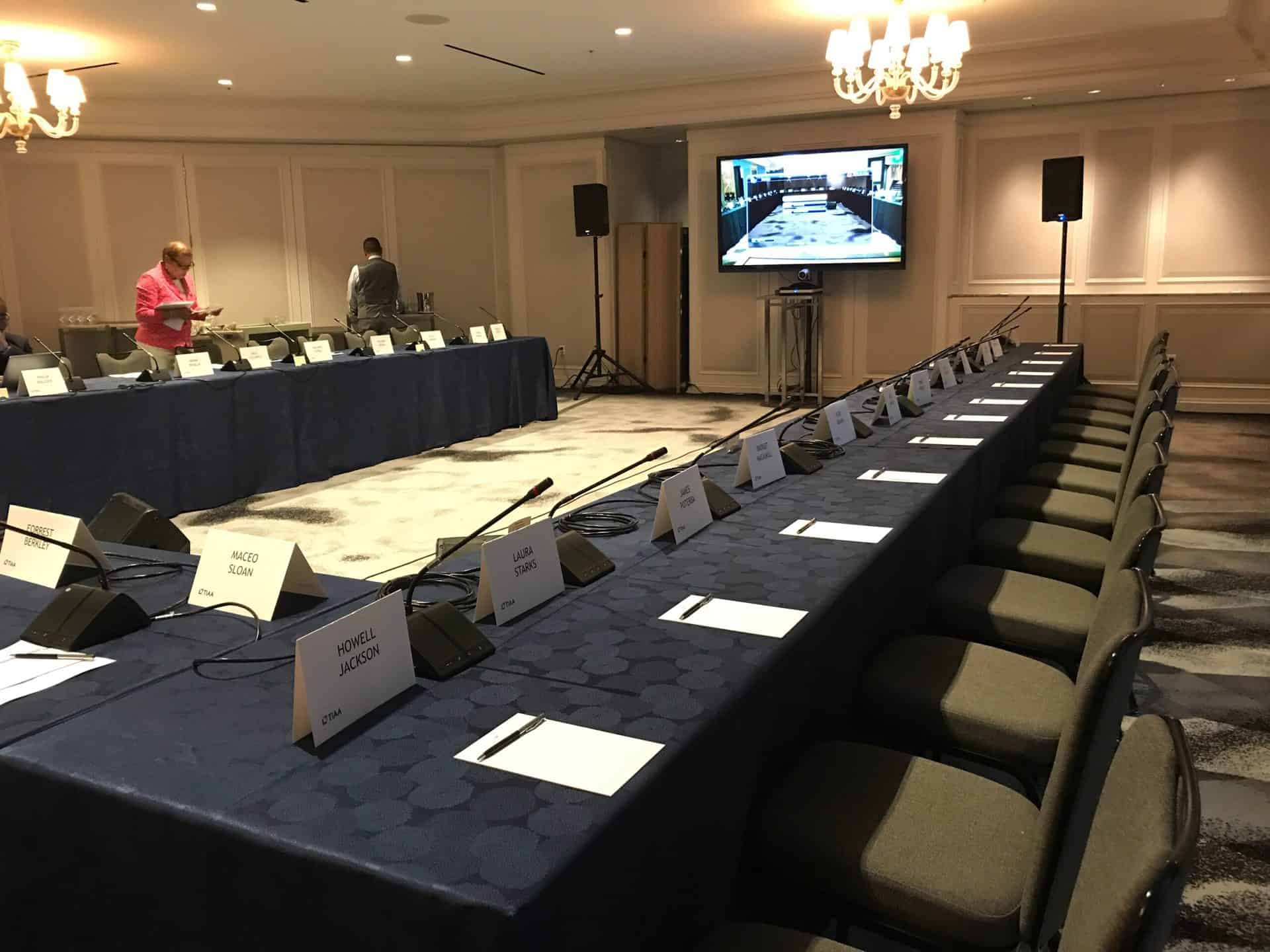Tables setup board room style in gooseneck microphones