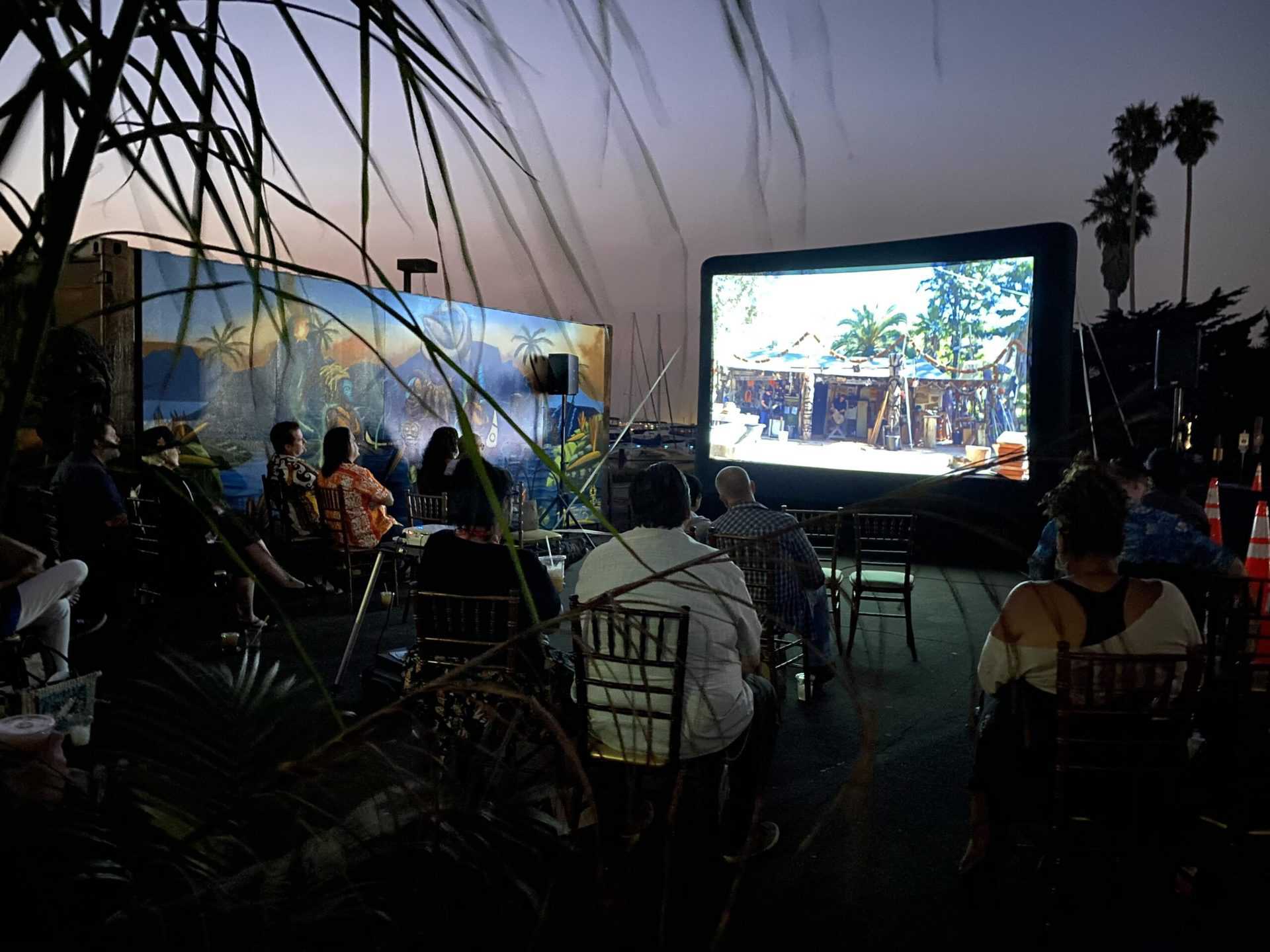 People watching outdoor movie