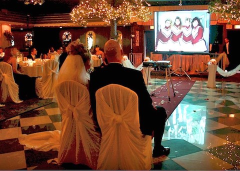 Married couple watching wedding video