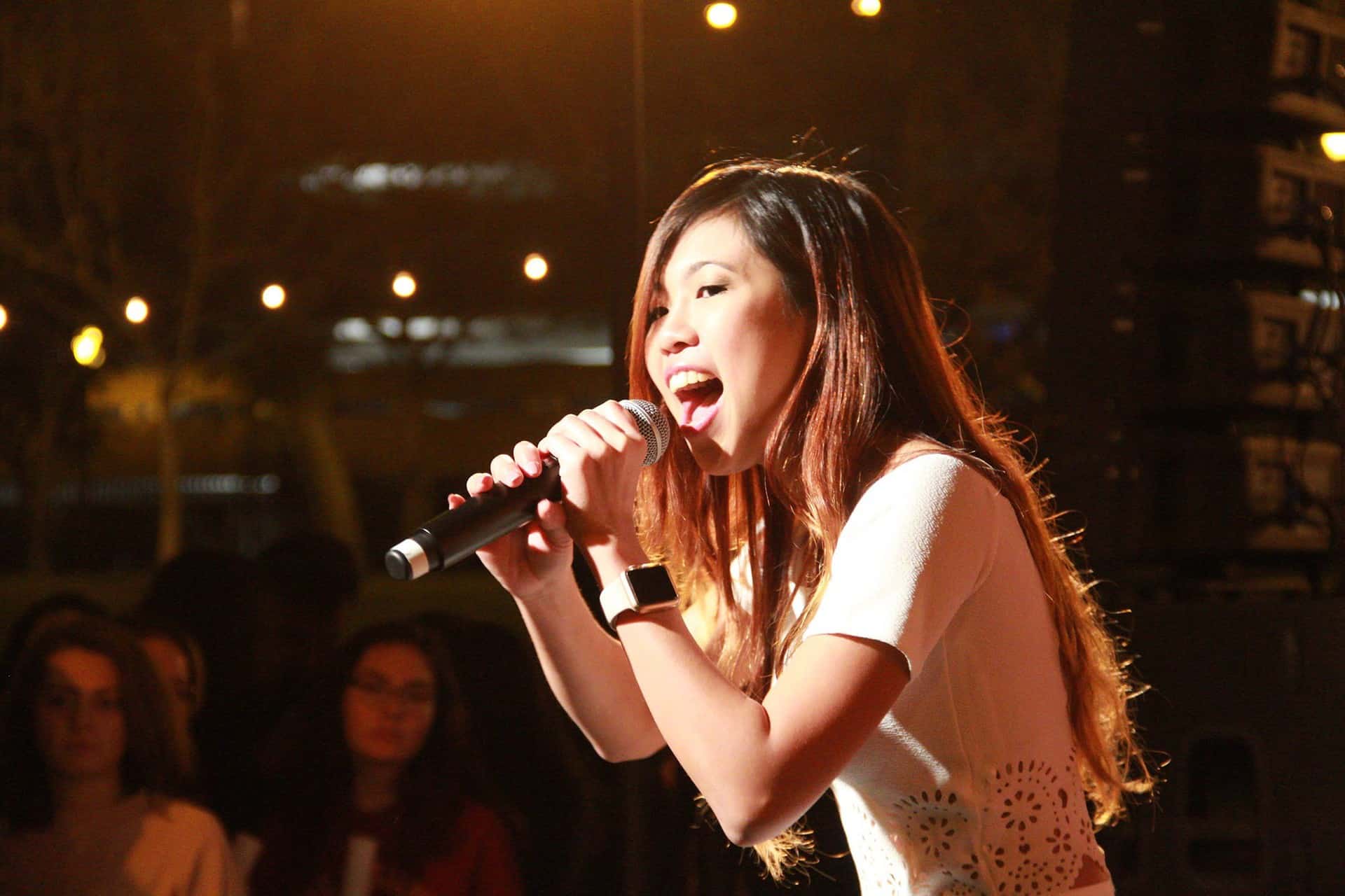 Girl singing into microphone