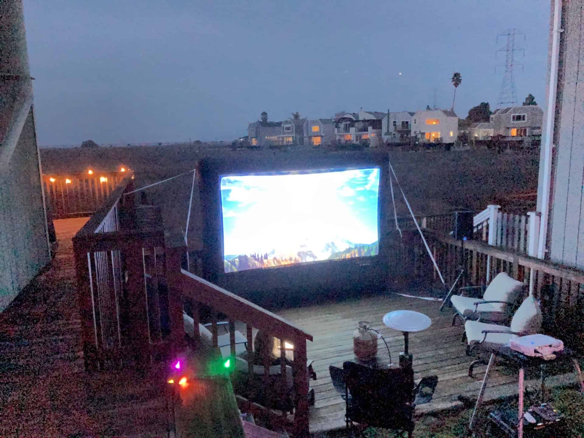small inflatable screen on a backyard deck