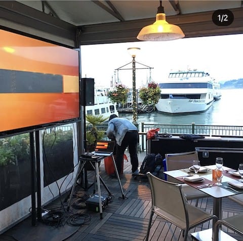 TV display with boat in background in San Francisco