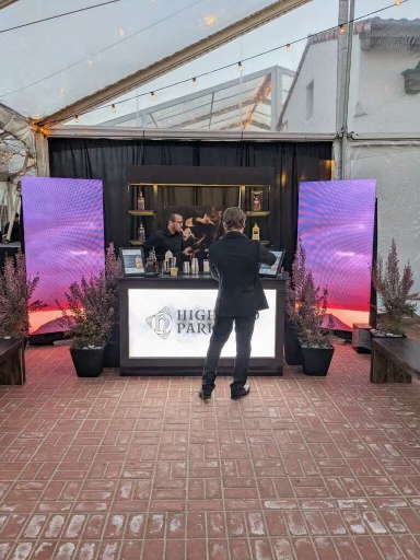 2 video pillars flank a bar in Pebble Beach