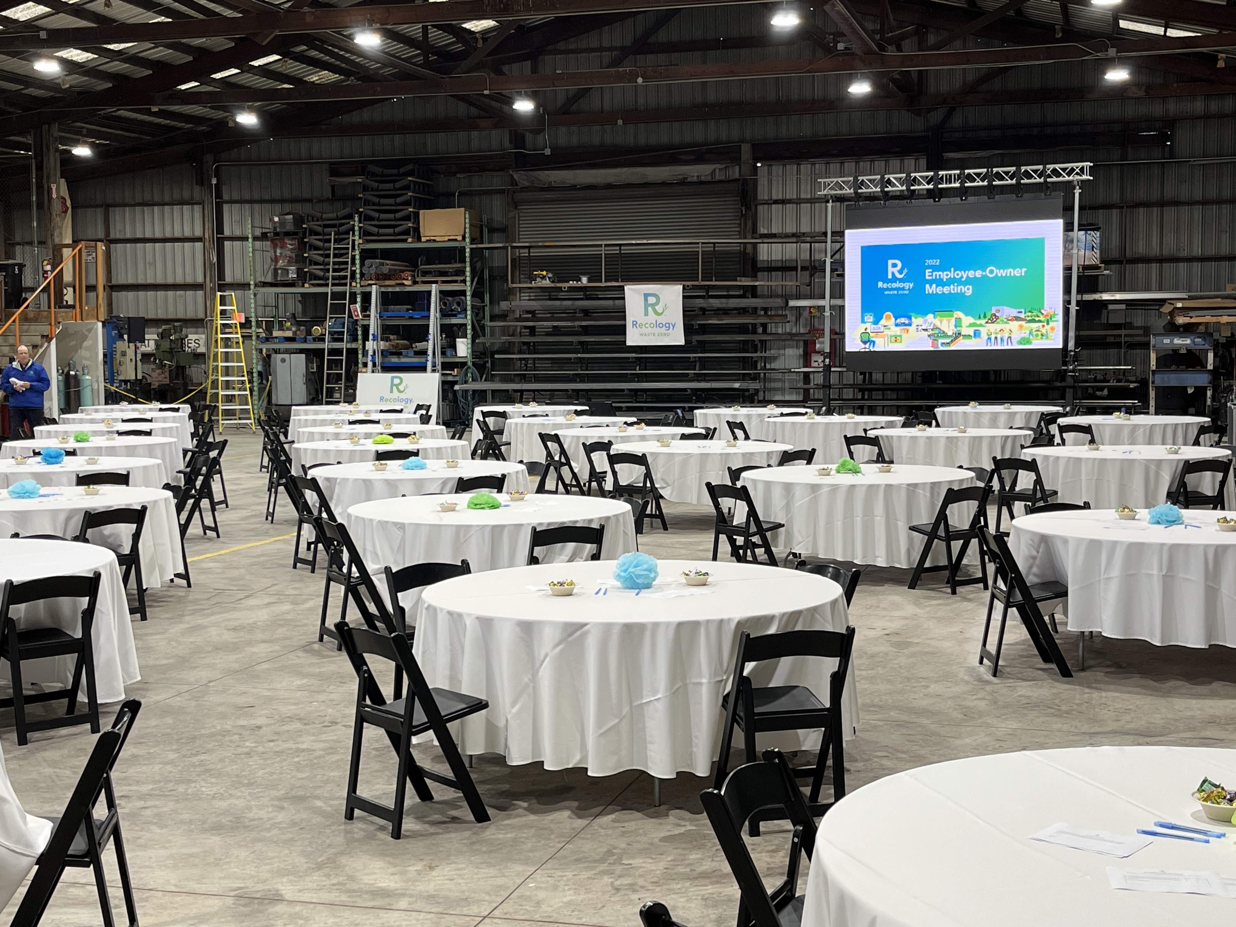 tables set in large room for company meeting