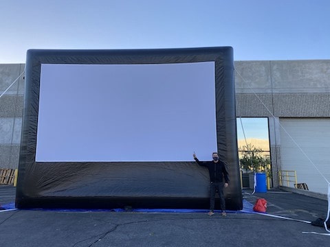 Large blow up screen being set up outside