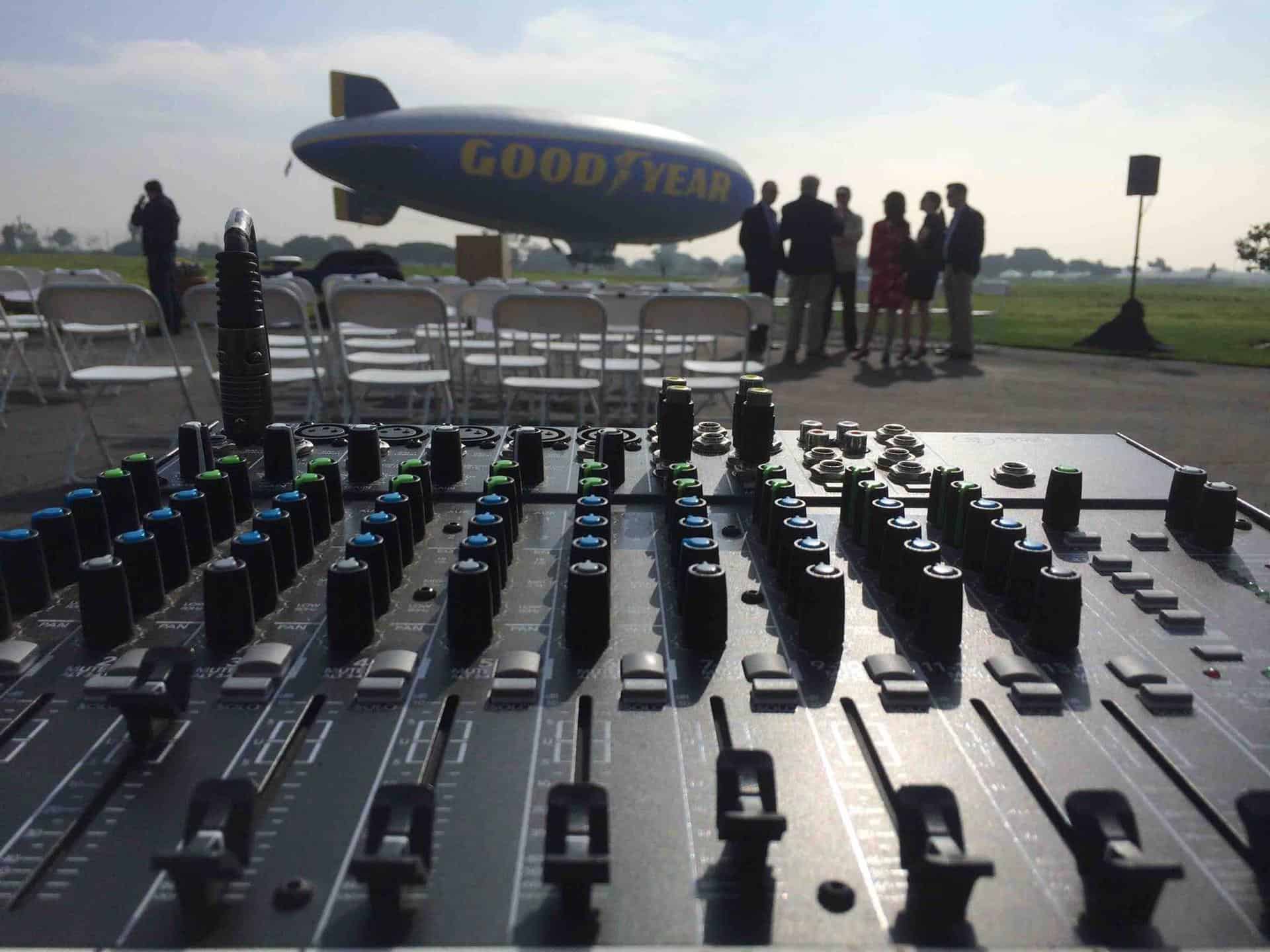 Audio mixer with Goodyear blimp in background