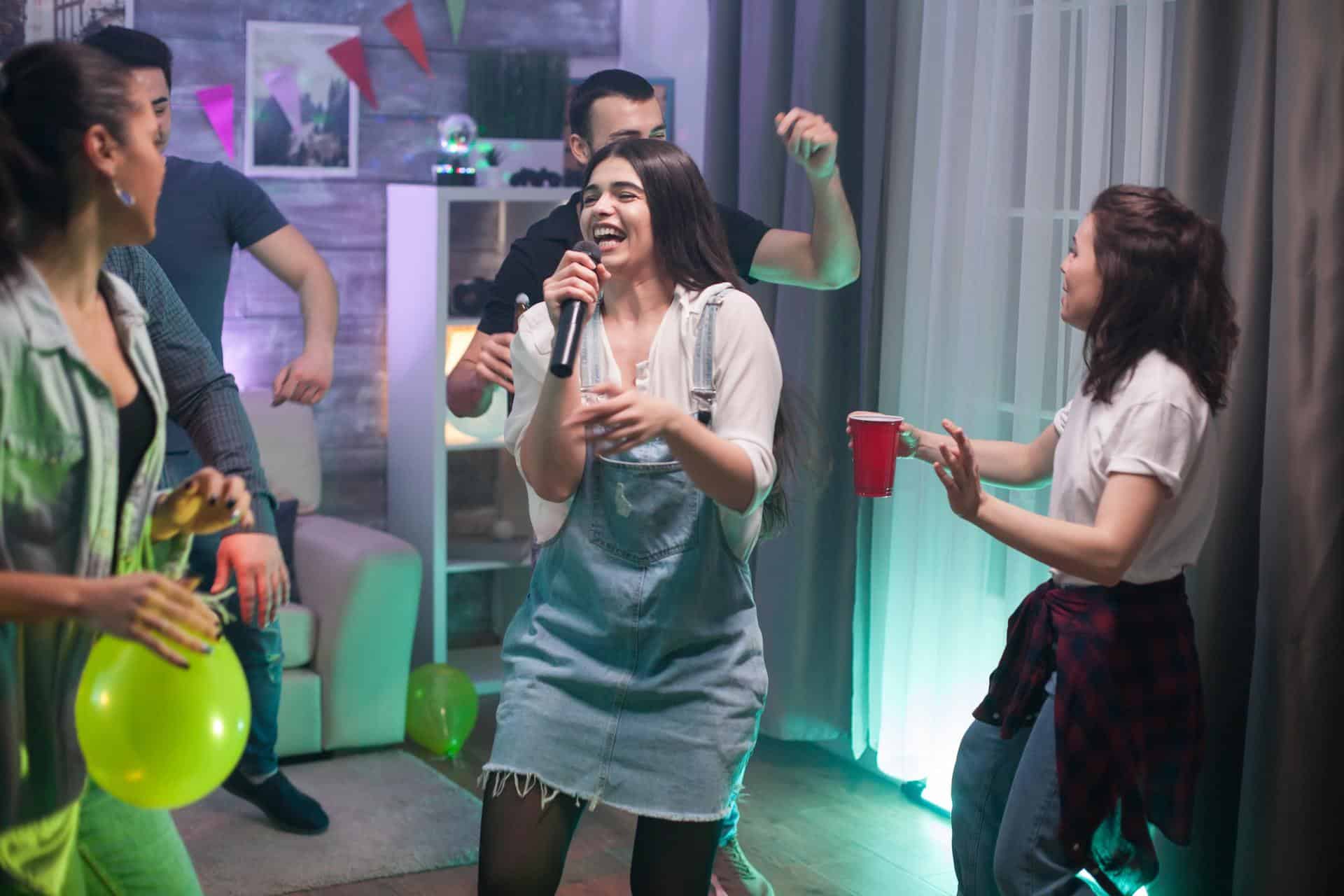 Group of friends singing together at the party