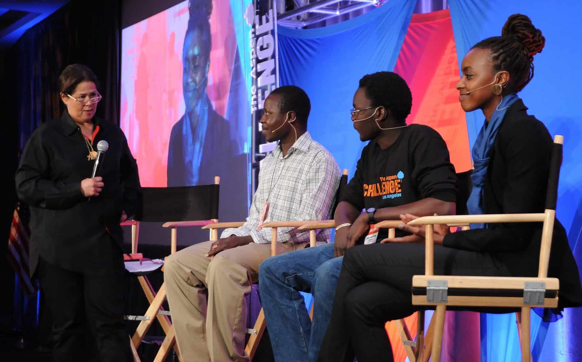 2 people in director's chairs being interviewed