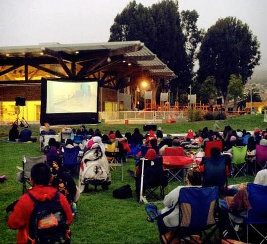 Crowd watching an outdoor movie in South San Francisco